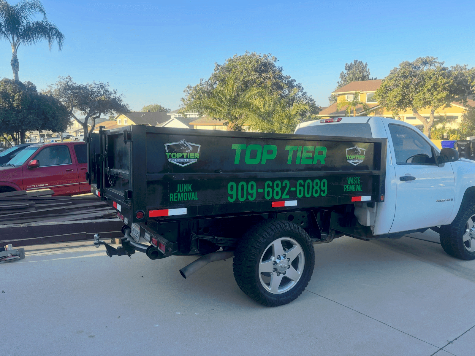 Top Tier Junk Removal & Hauling crew with branded equipment in Rialto, CA